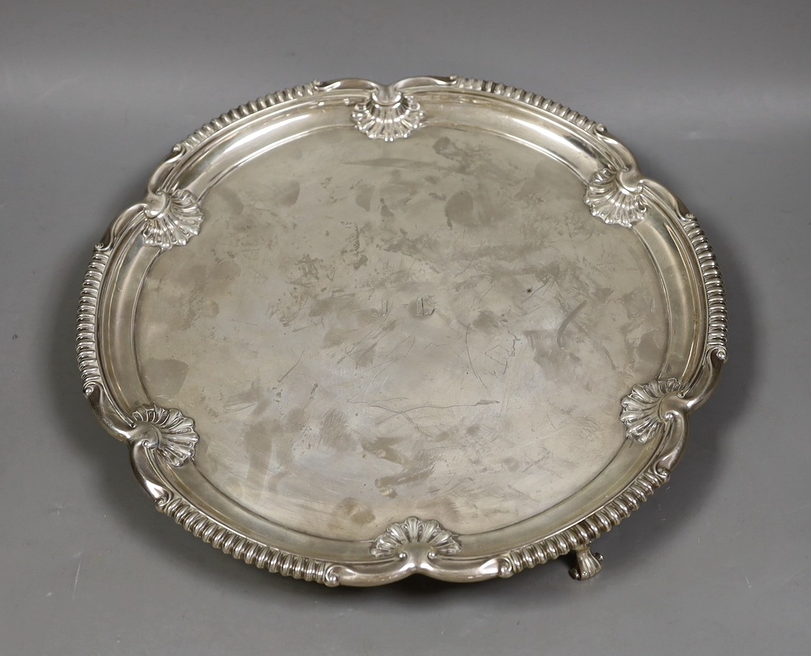 A George V shaped circular silver salver by Elkington & Co, Birmingham, 1931, with engraved initials, 30cm, 27.1oz.